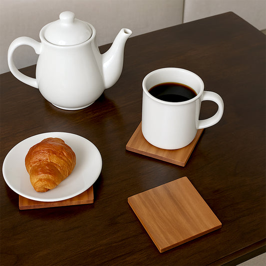 Mahogany Mist Coaster - Lifestyle Image of Mahogany Mist Coaster on a Table with Coffee Mug 